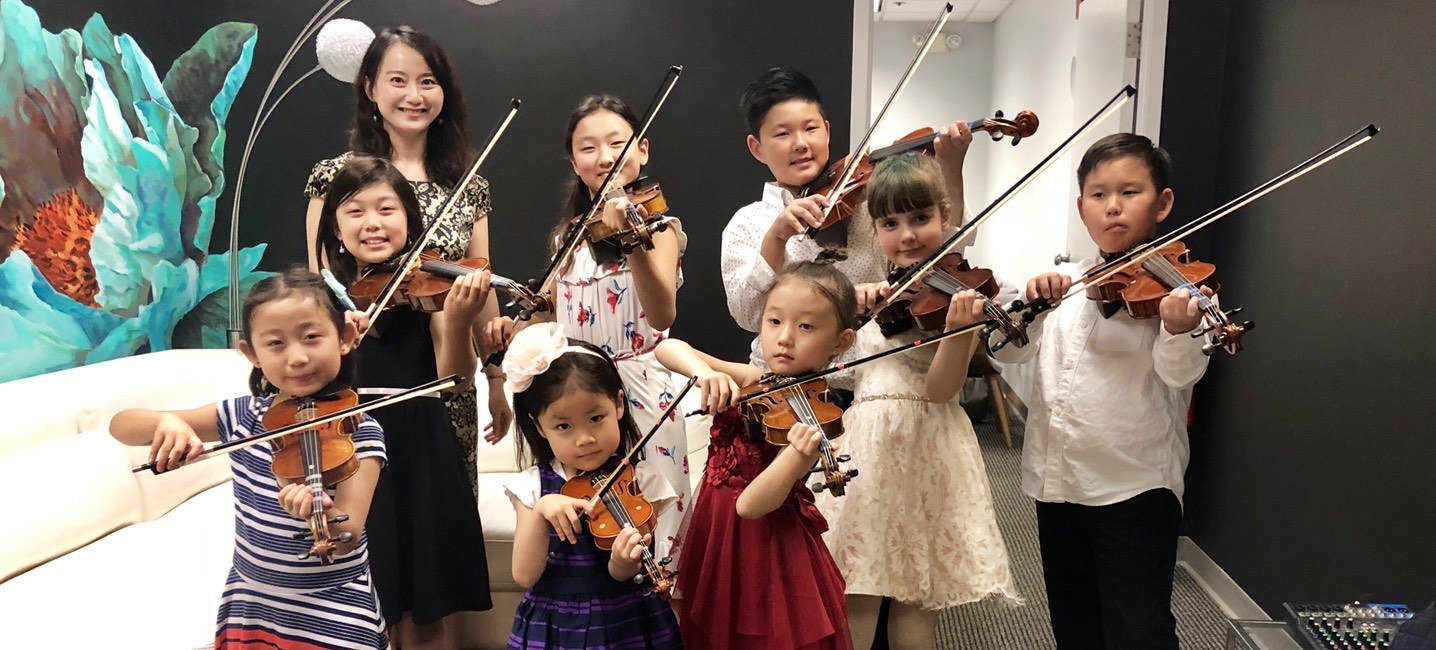 Student playing violin during a private lesson